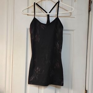 Lululemon tank Size 2-4, in good used condition.  Comes with removable bra pads.